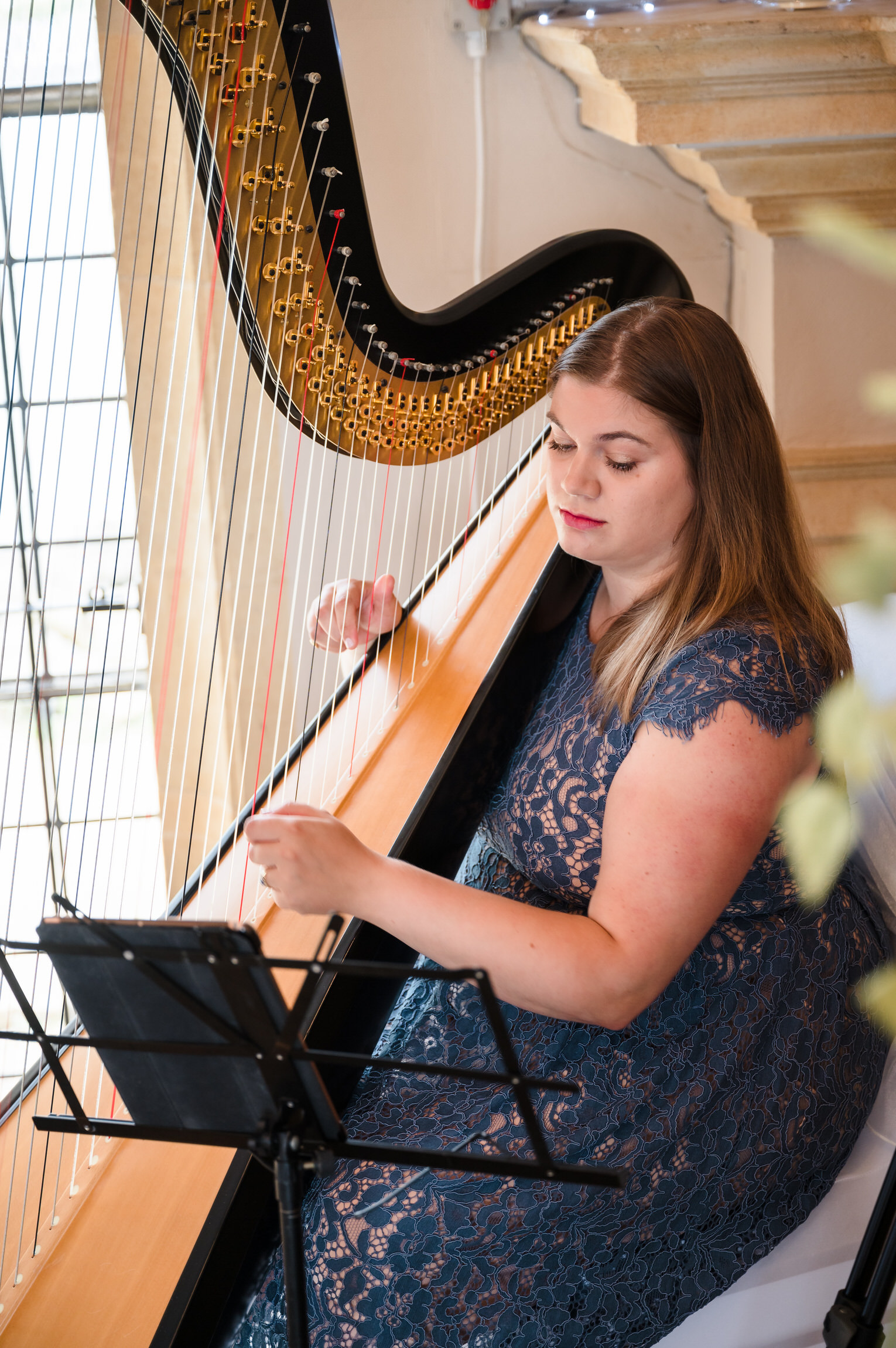 Harriet Flather harpist playing at Normanton Church