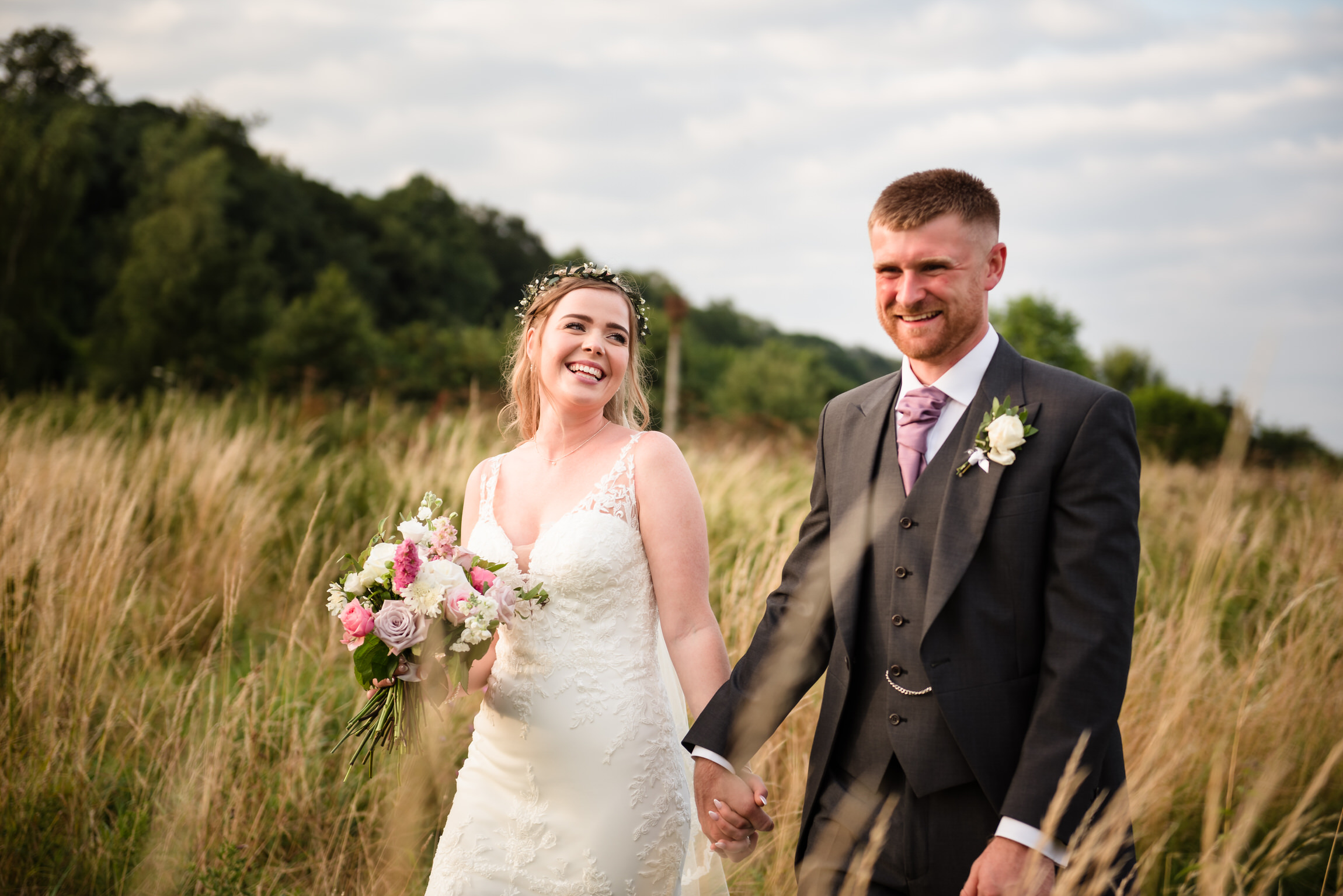 Bride and groom portraits in long grass