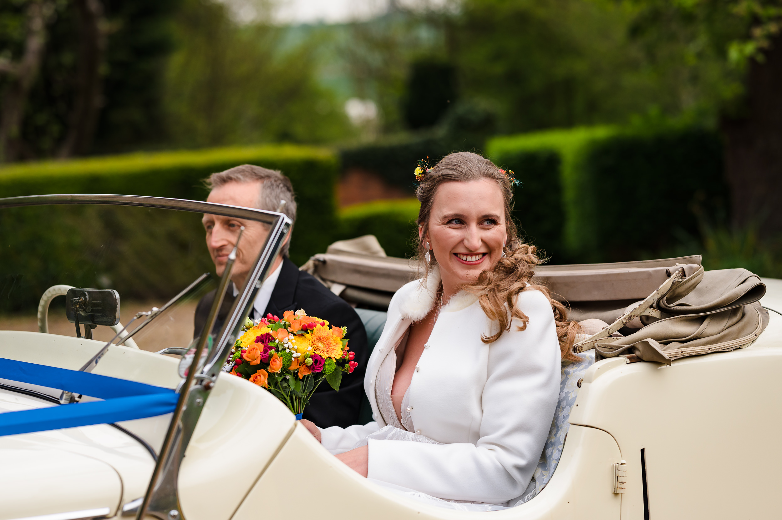 bride arriving in vintage car for dodmoor house wedding