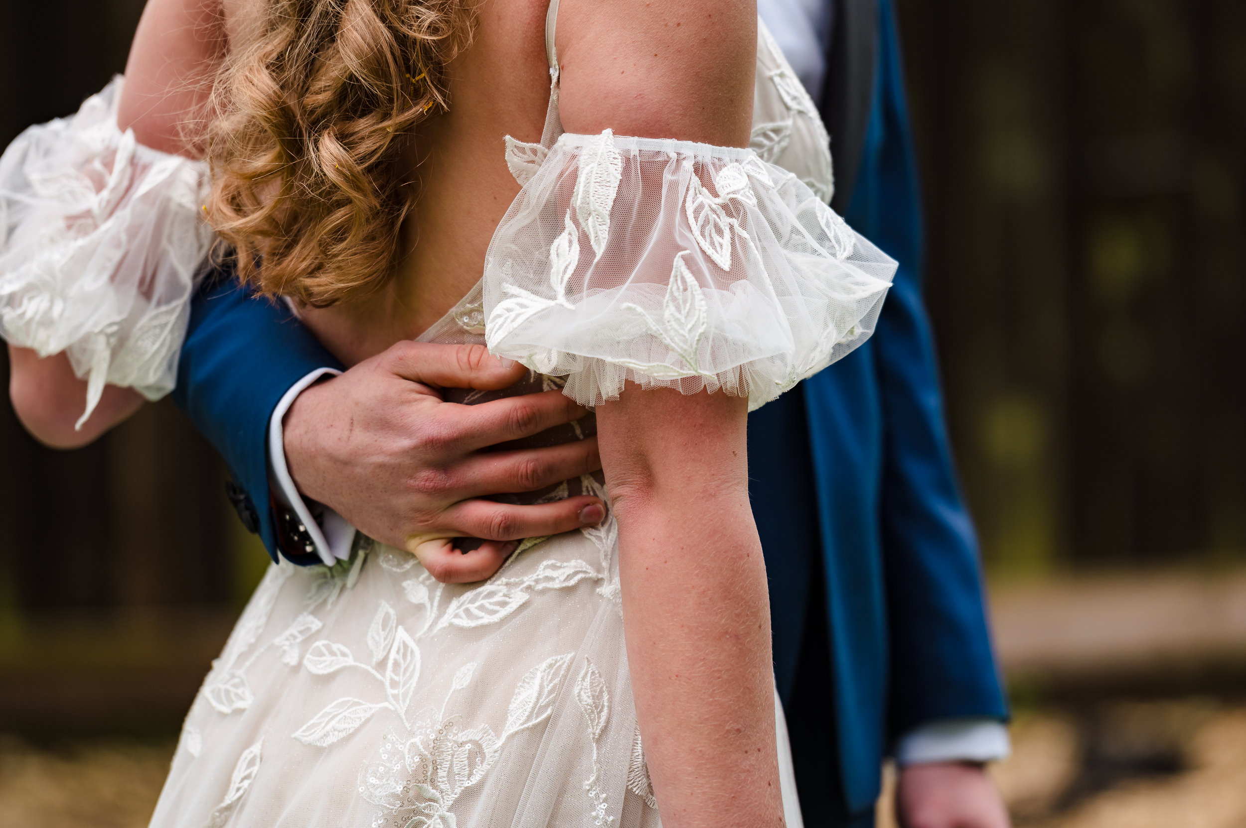 grooms arm around bride waist at dodmoor house