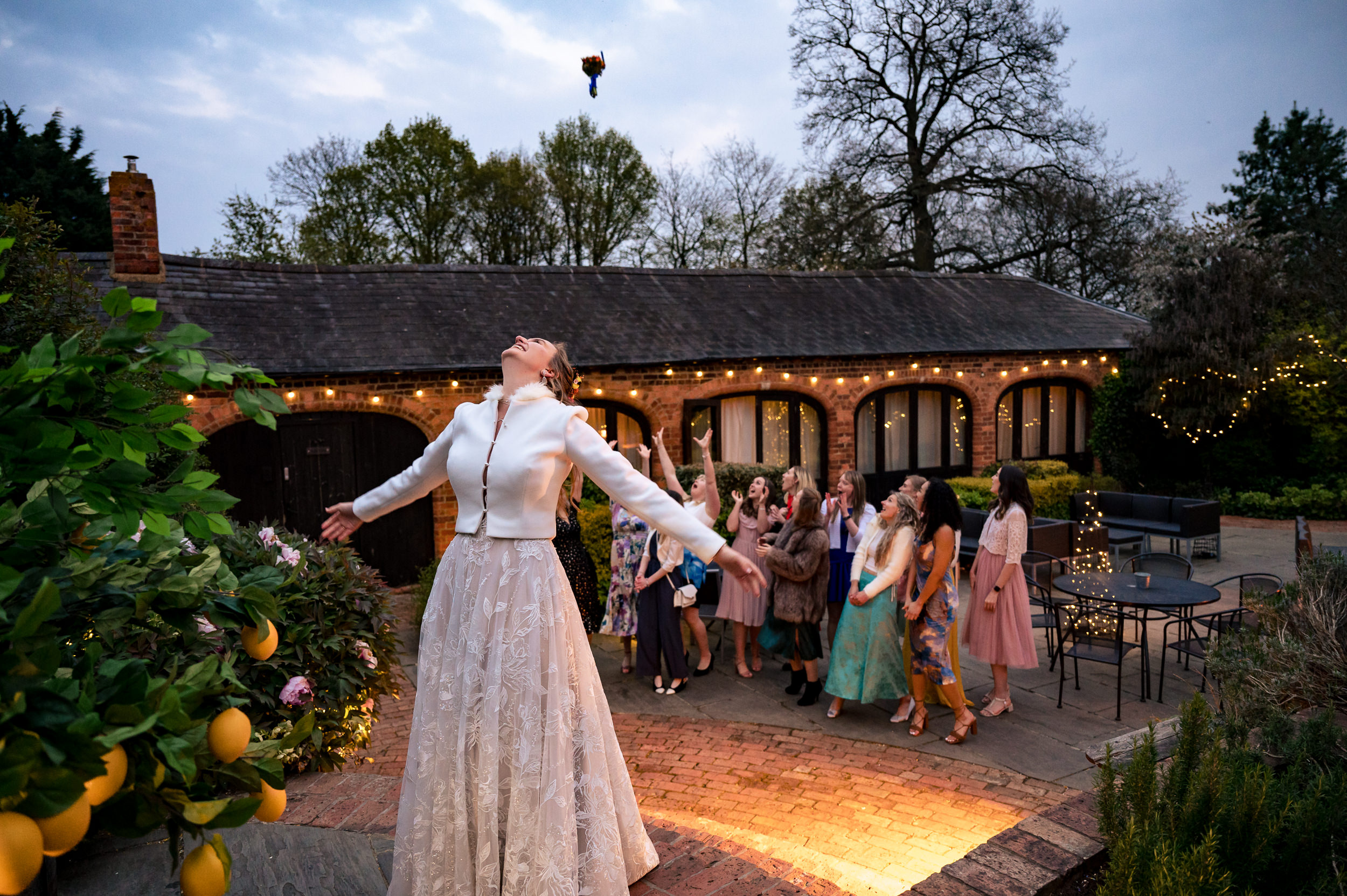 bride throwing her bouquet at dodmoor house