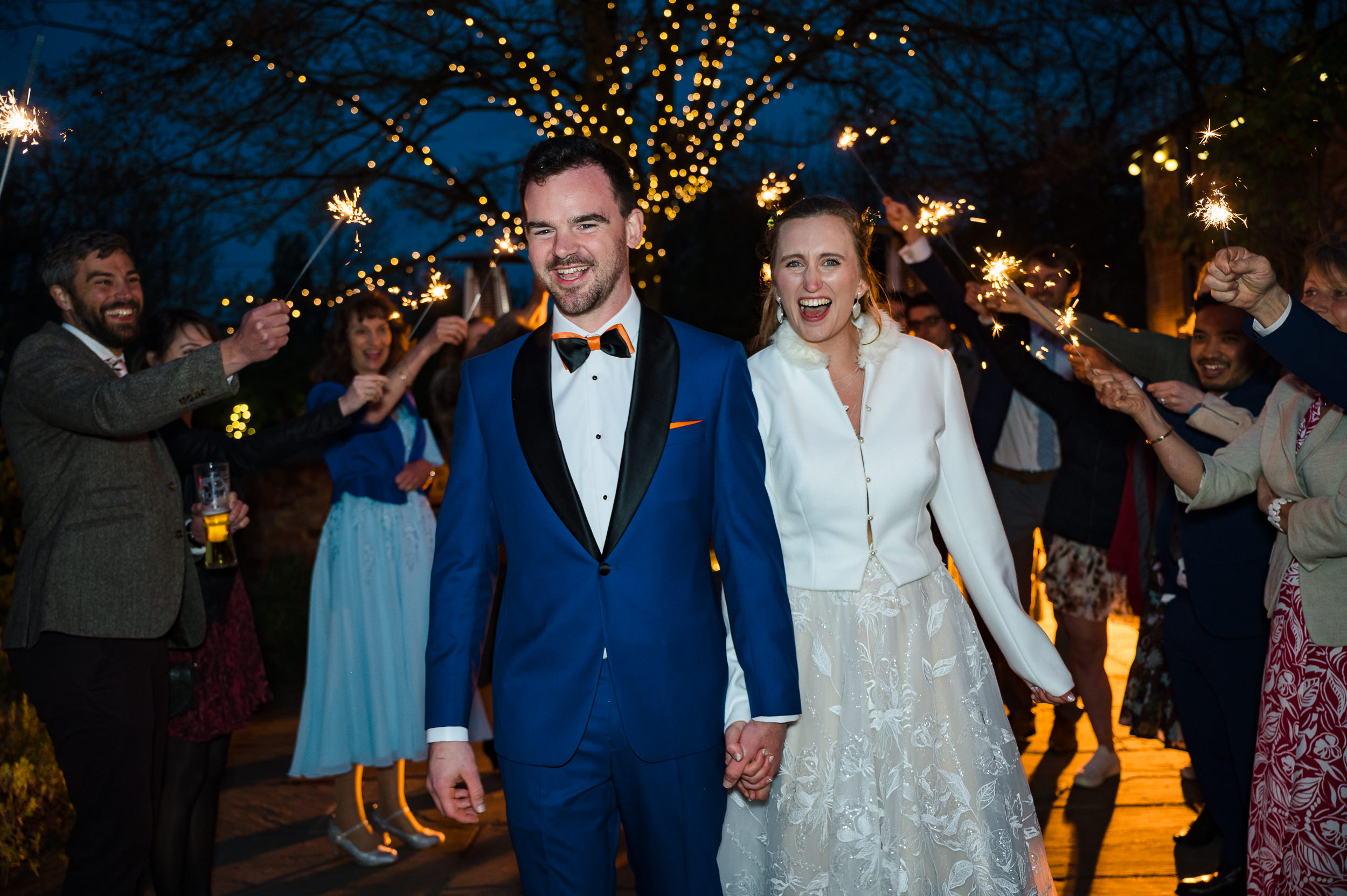bride and groom walking through sparklers dodmoor house wedding