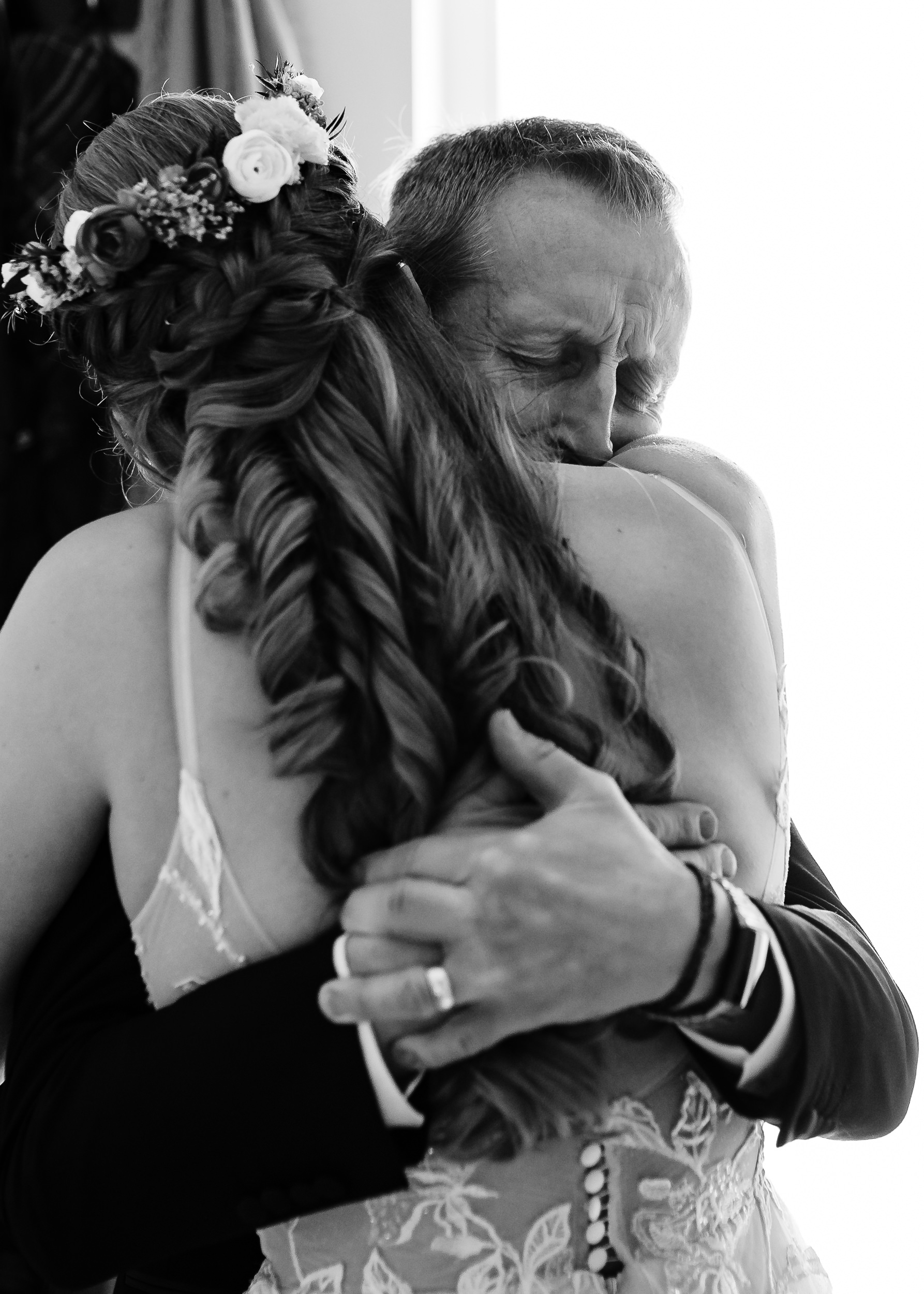 Dad hugging his daughter