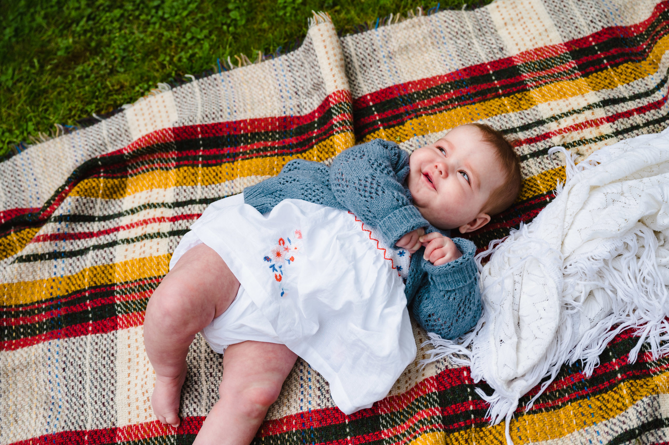 little girl on blanket in garden family photoshoot rutland