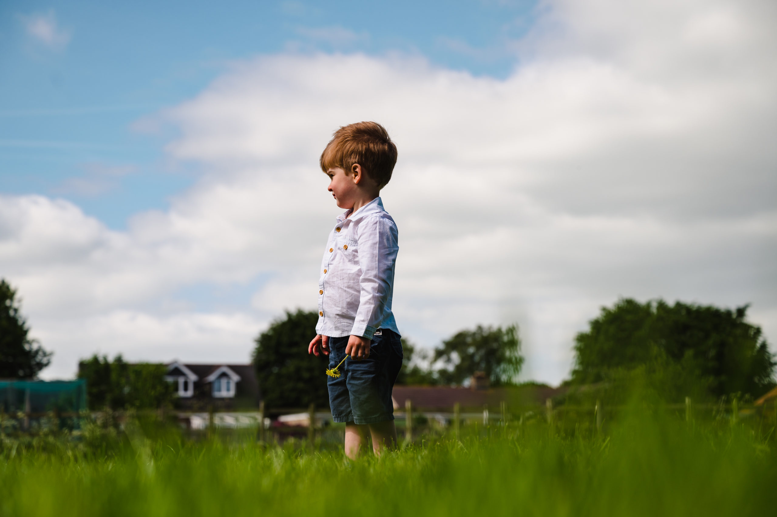 Boy stood in field family photoshoot rutland