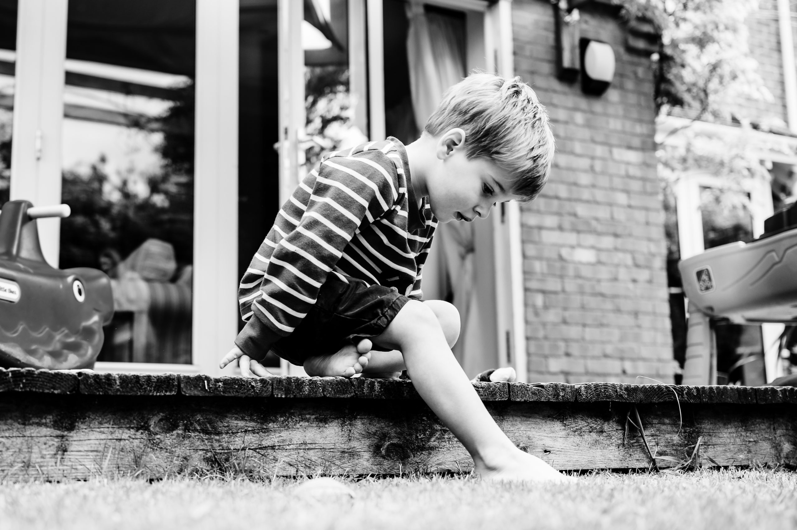 Boy sitting on the patio on family photoshoot in rutland