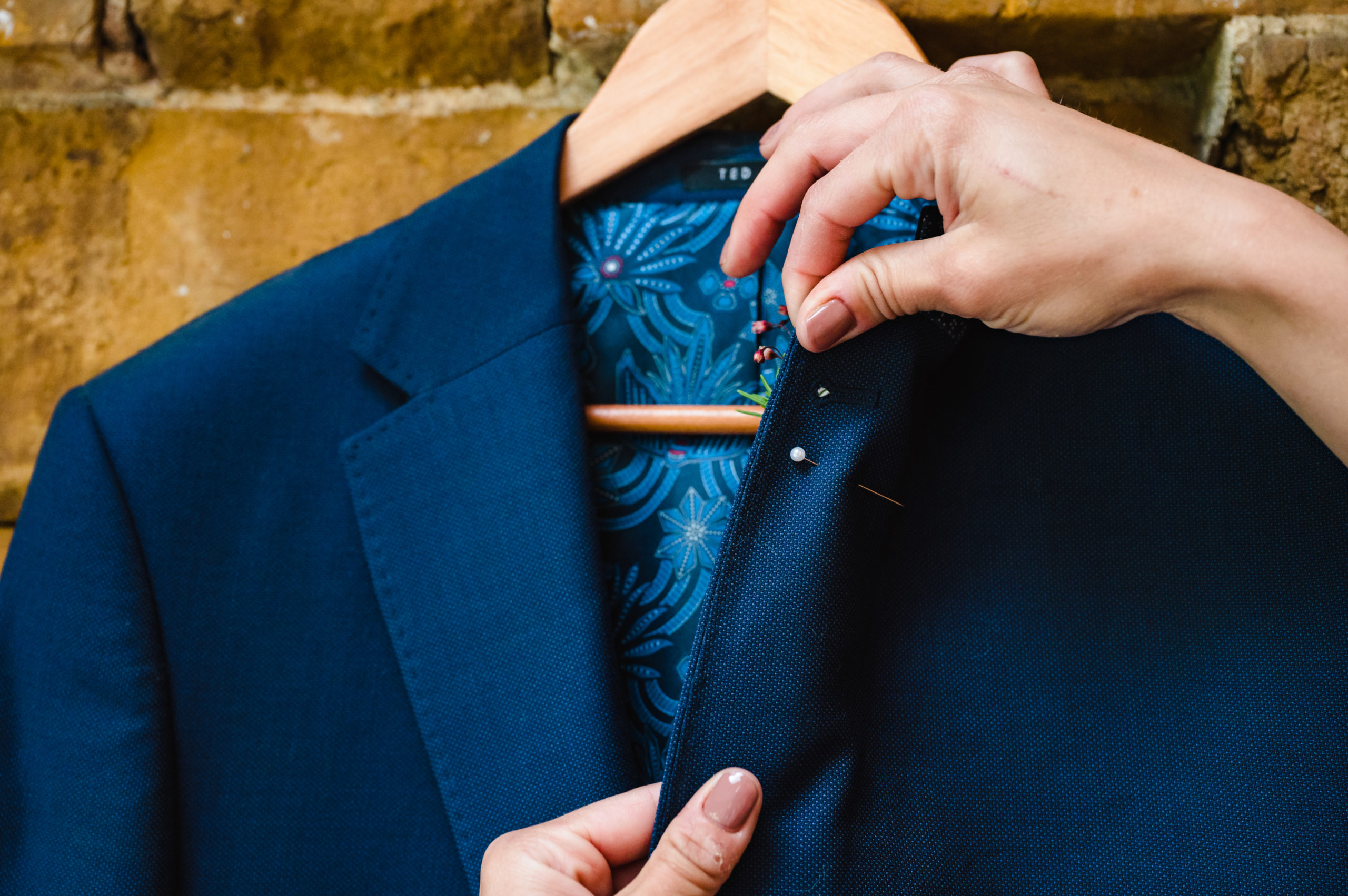showing the back of a correctly pinned buttonhole