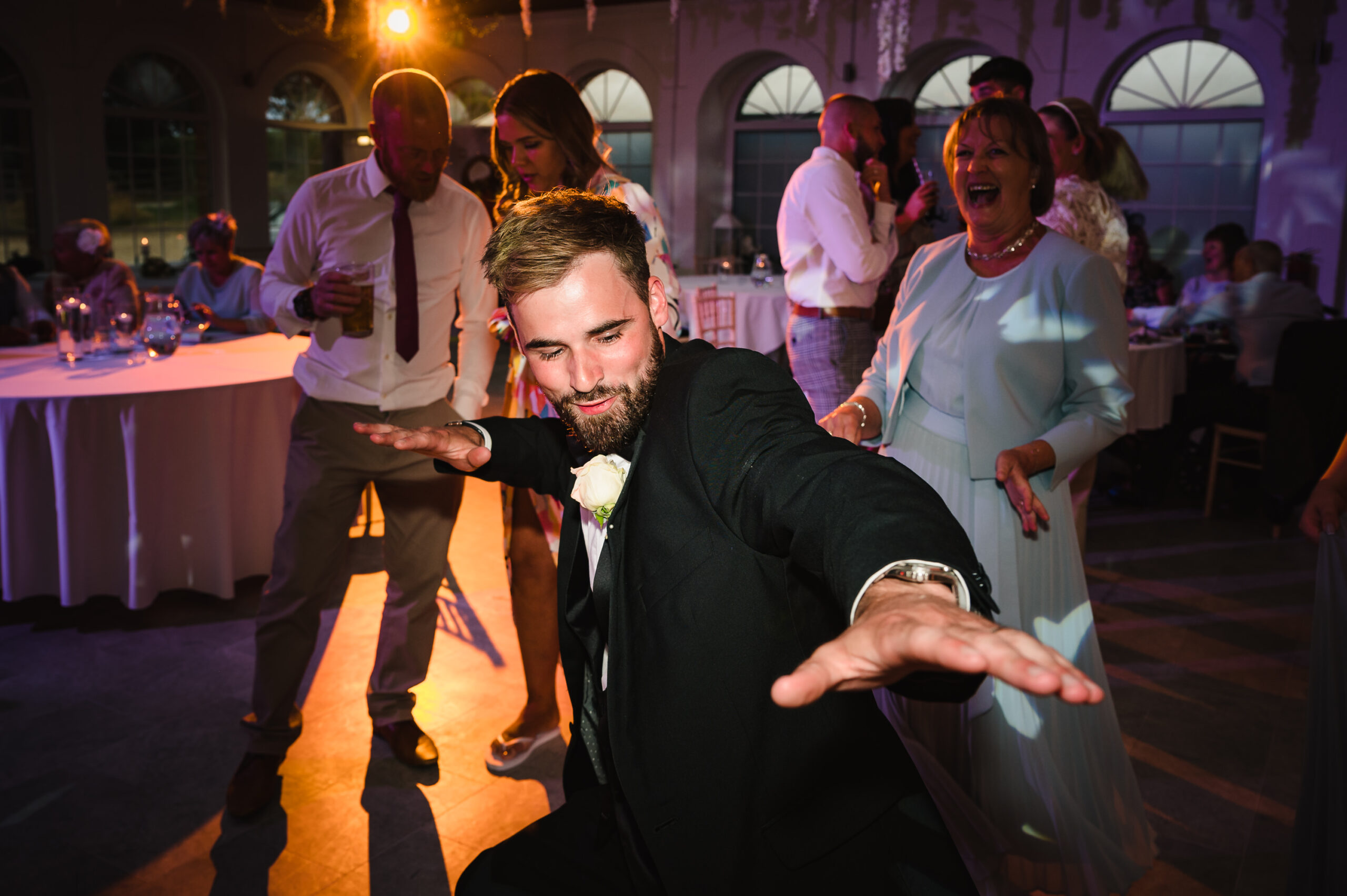 groom dancing to band at his wedding