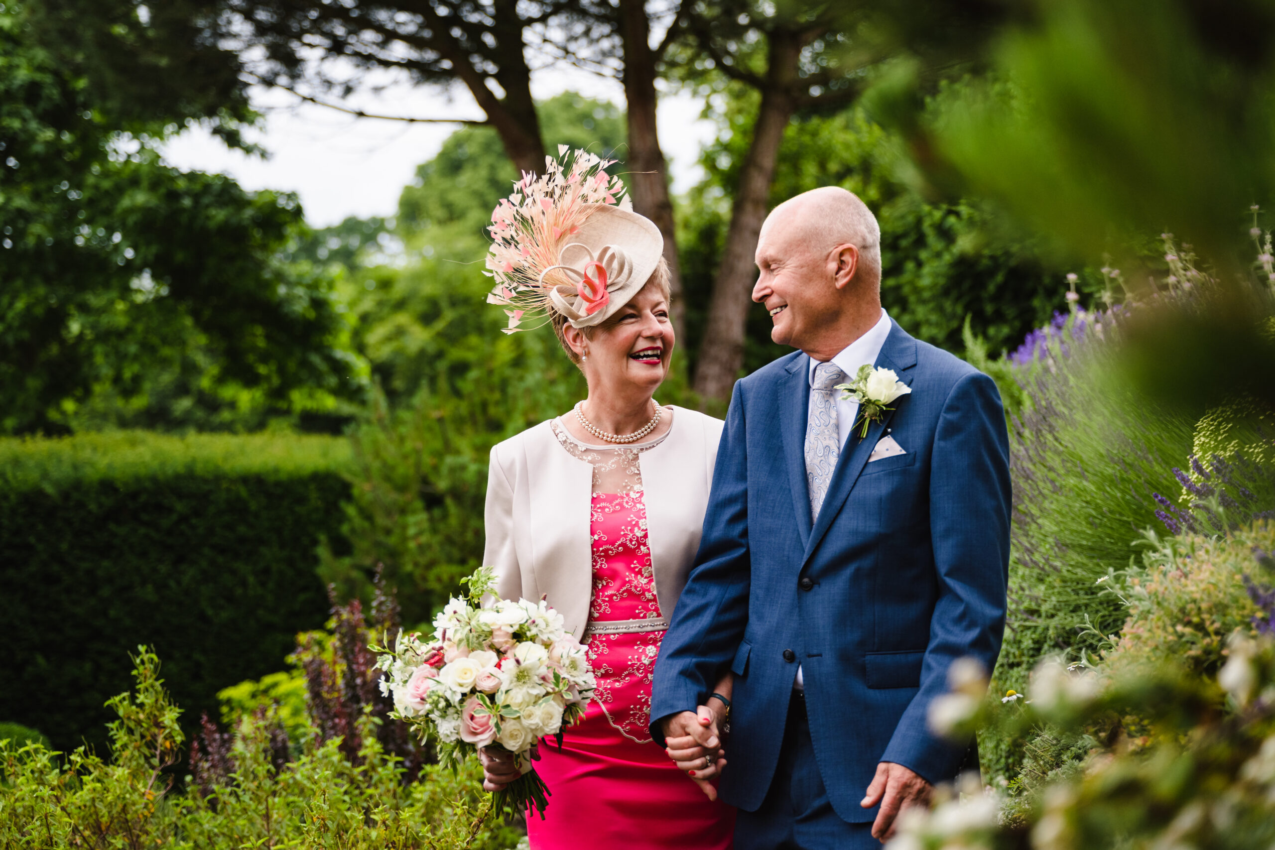 bride and groom in hambleton hall gardens