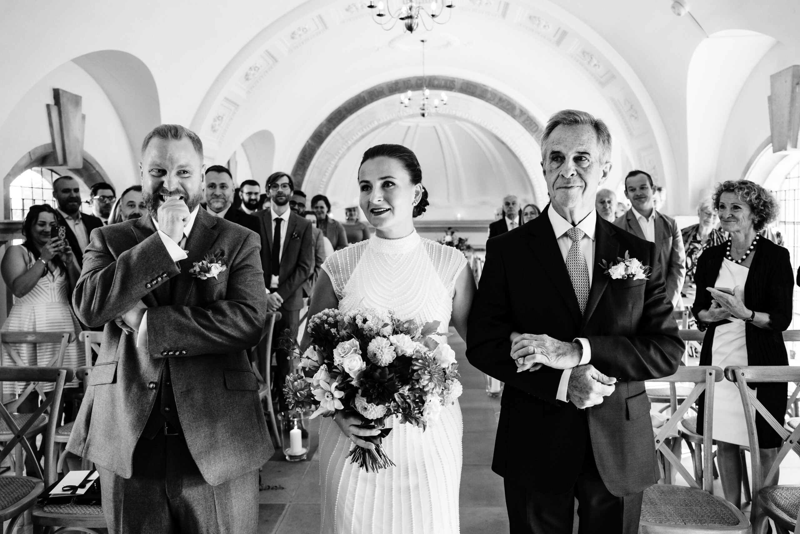 A rutland water wedding at normanton church groom seeing his bride for the first time