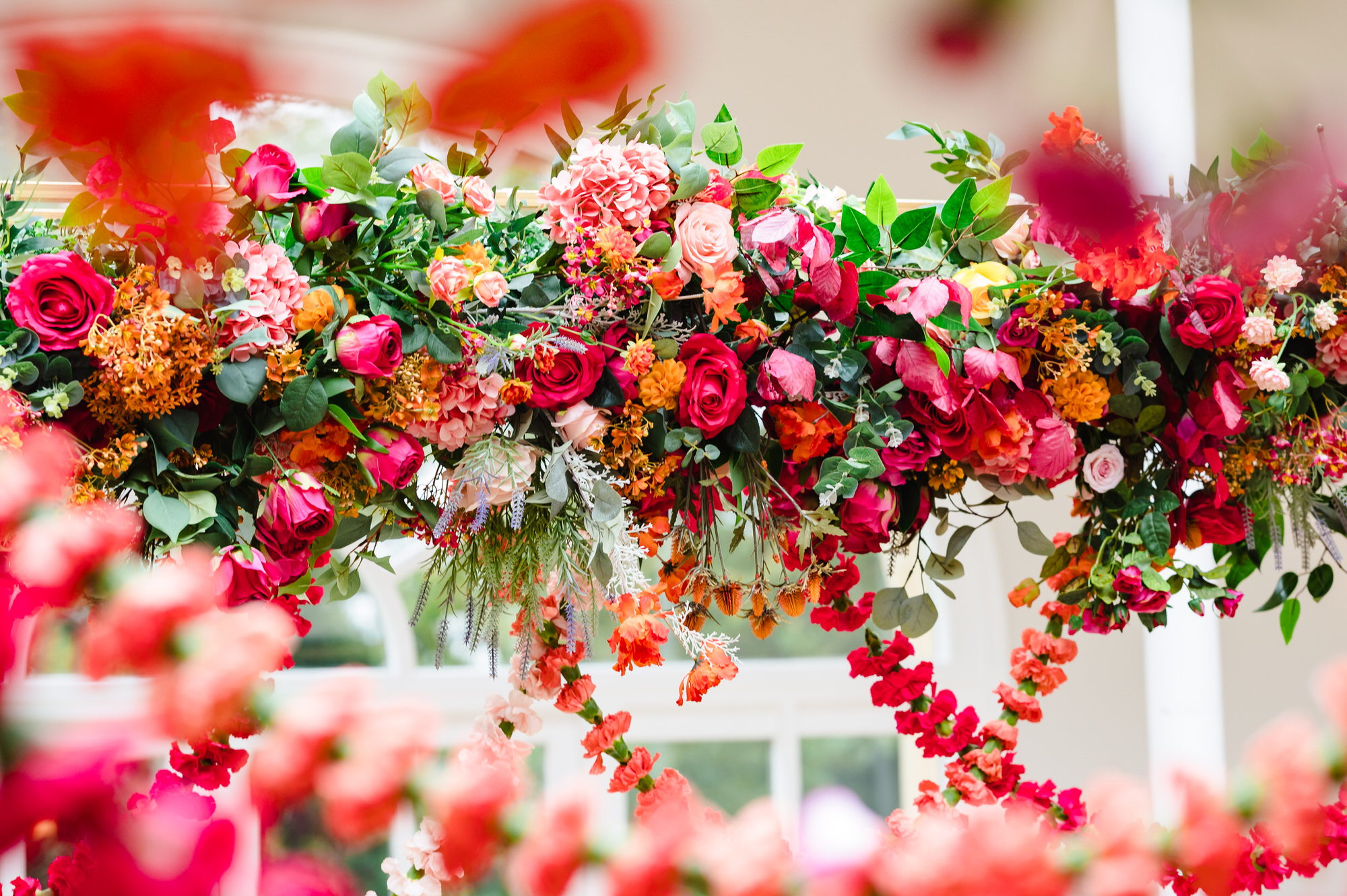 bright and bold wedding florals decorate a Mandup