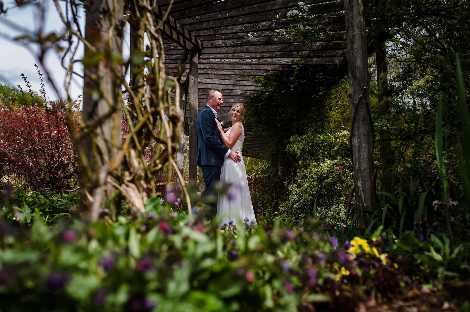 couple posing for wedding portrait in barnsdale gardens