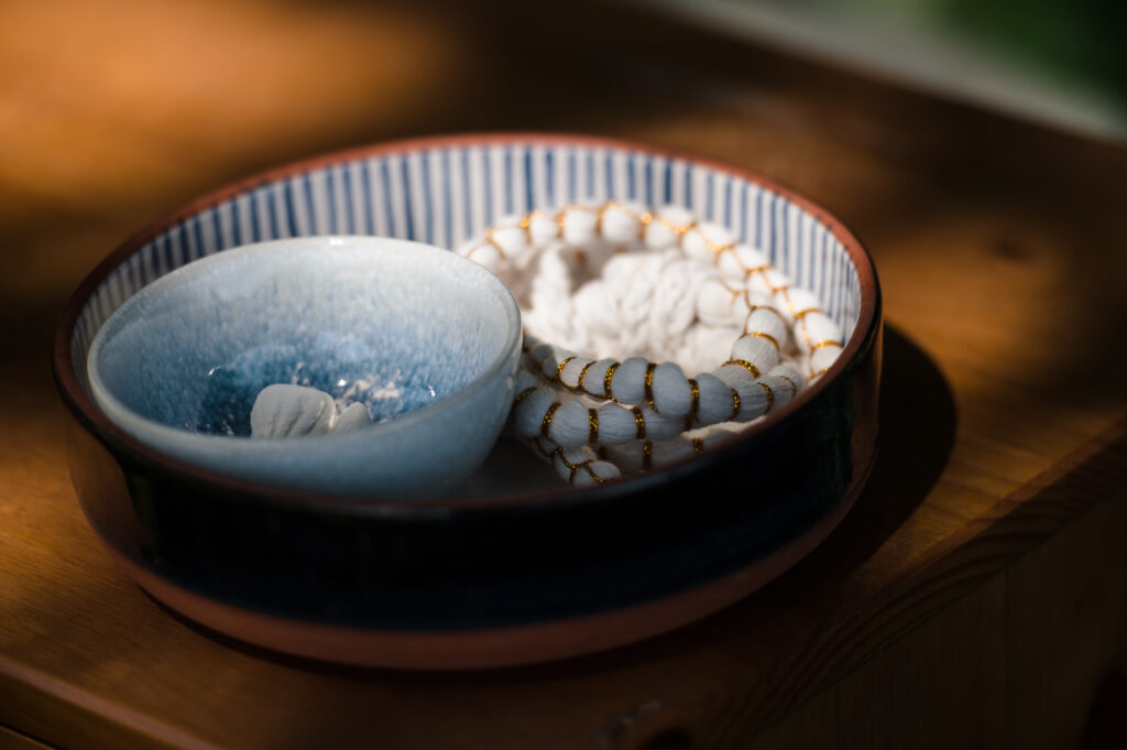 Bowl with shells and beads for Thai water pouring ceremony
