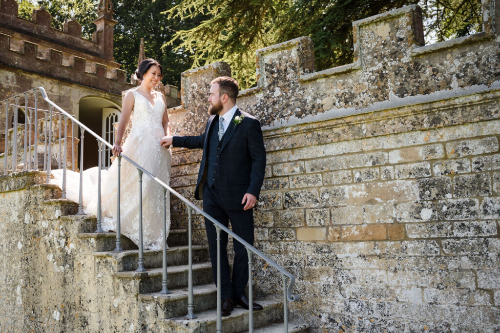 bride and groom walking down stairs at fort henry