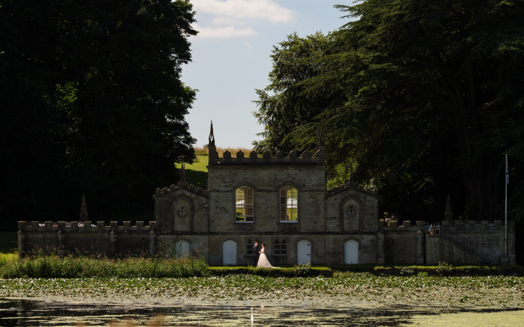 f wedding couple accross the lake at fort henry exton
