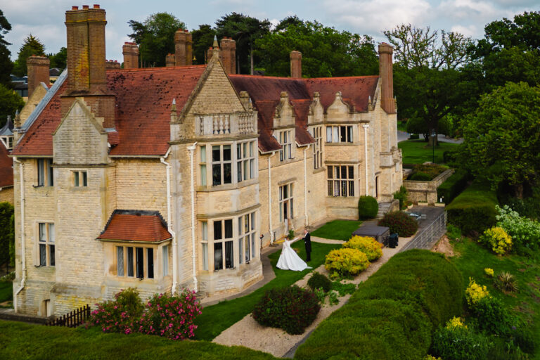 Drone shot of bride and groom outside honeymoon suite at rutland hall